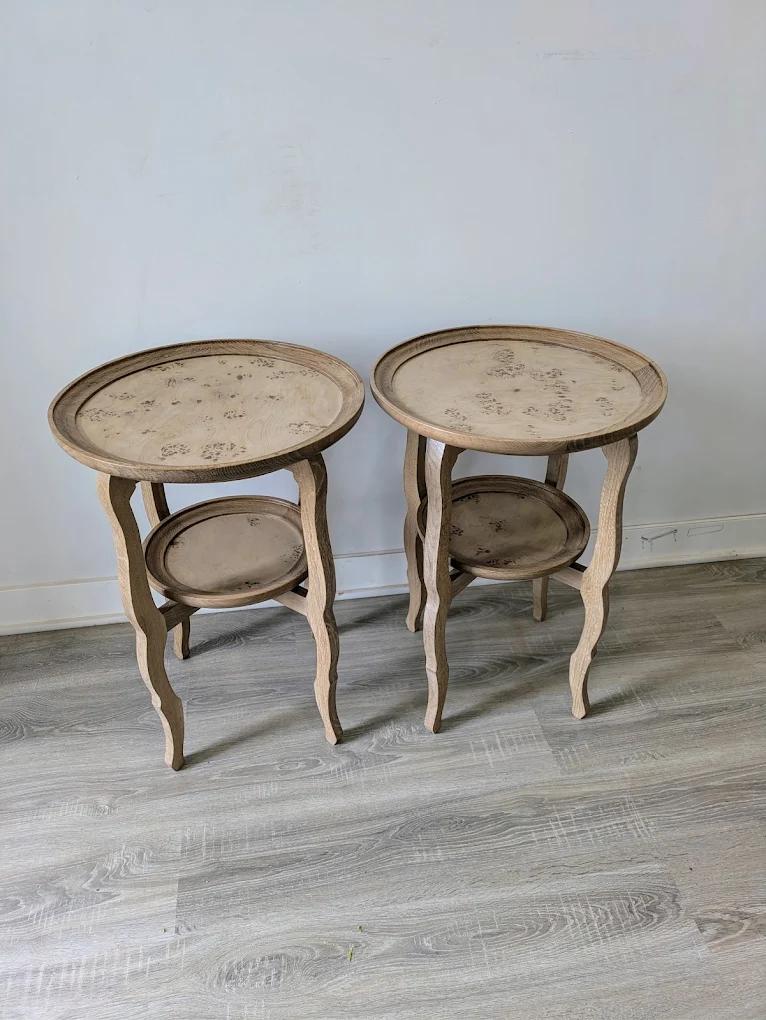 Pair of pale two-tier side tables with burl tops